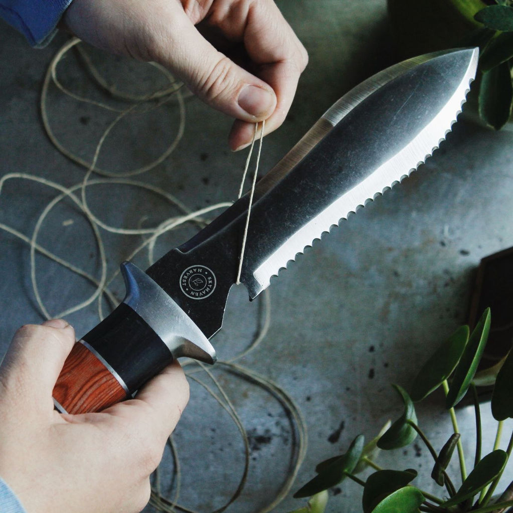 Cutting twine with a Hori Hori Garden Tool